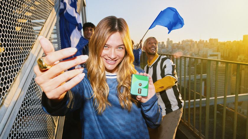 green Motorola Razr FIFA 2026 edition in a woman's hand