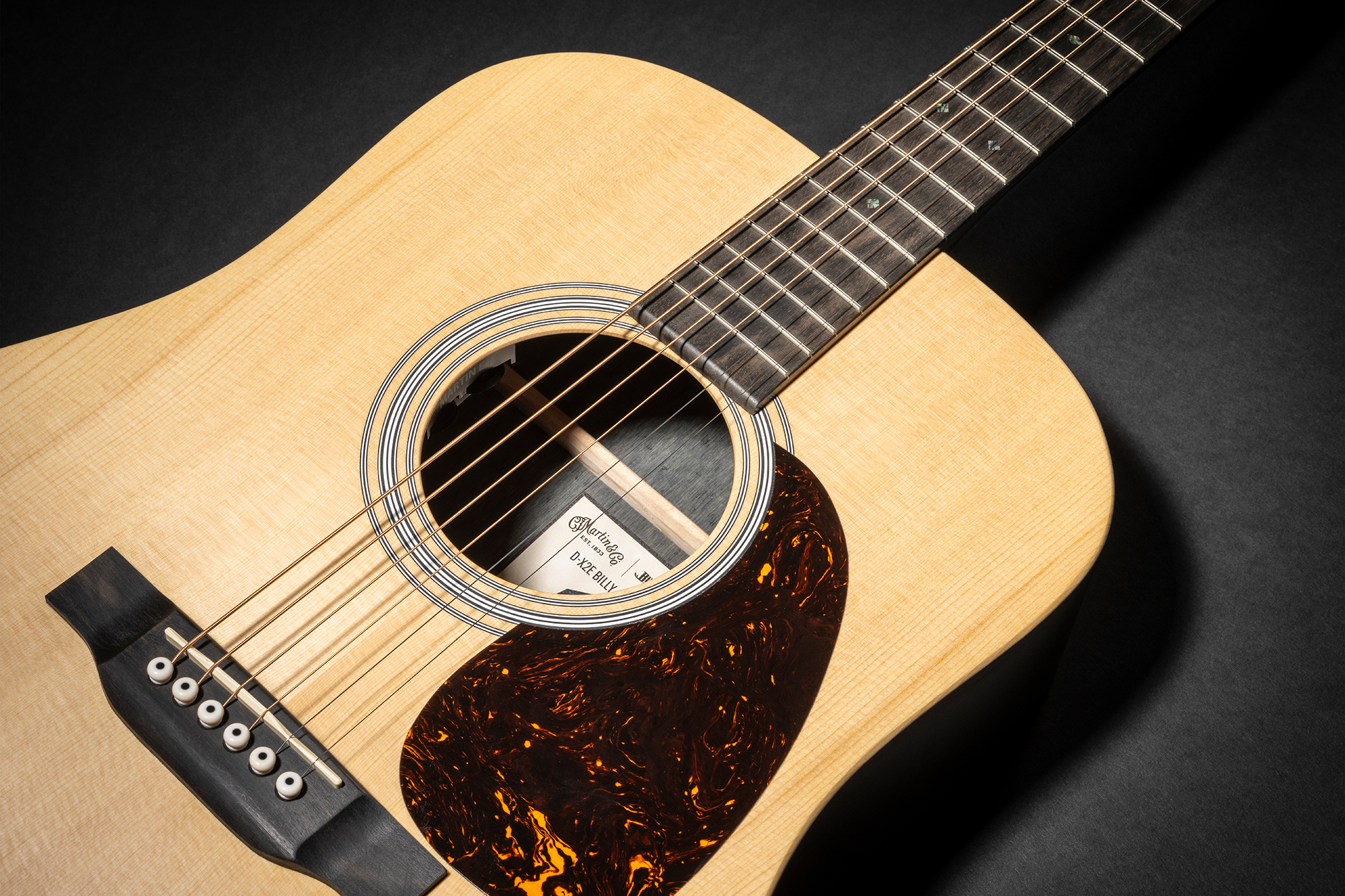 A promo photo for the Martin DX-2E Billy Strings acoustic-electric guitar