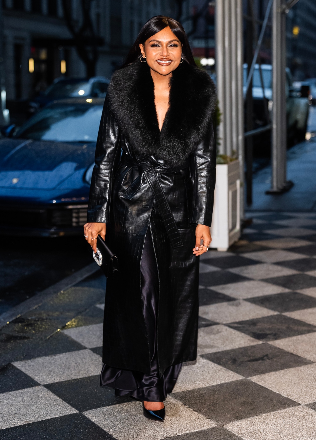 Mindy Kaling wearing black coat