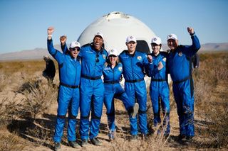 The NS-19 crew celebrates after the safe landing of their suborbital flight on Dec. 11, 2021.