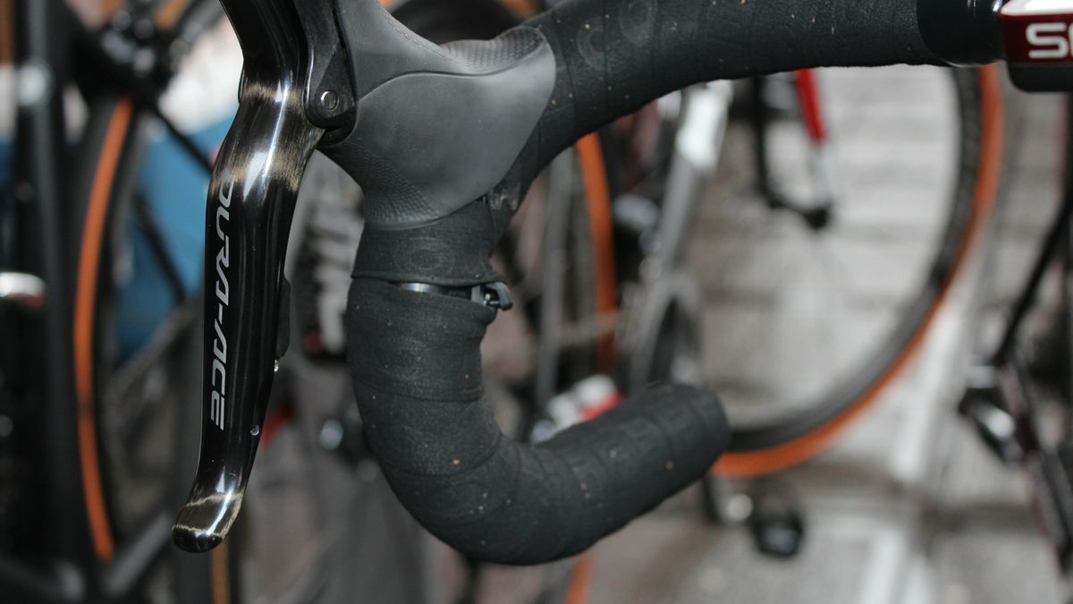 There are a few different ways to wrap around or over a Shimano Di2 sprint shifter