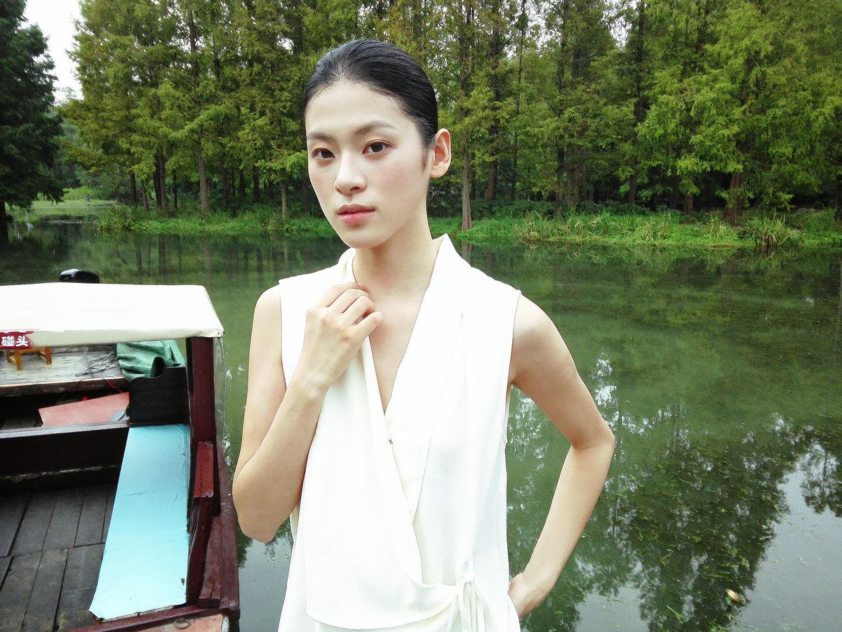 Fujifilm Instax Pal 2 sample gallery: female model in white dress next to a forest lined lake