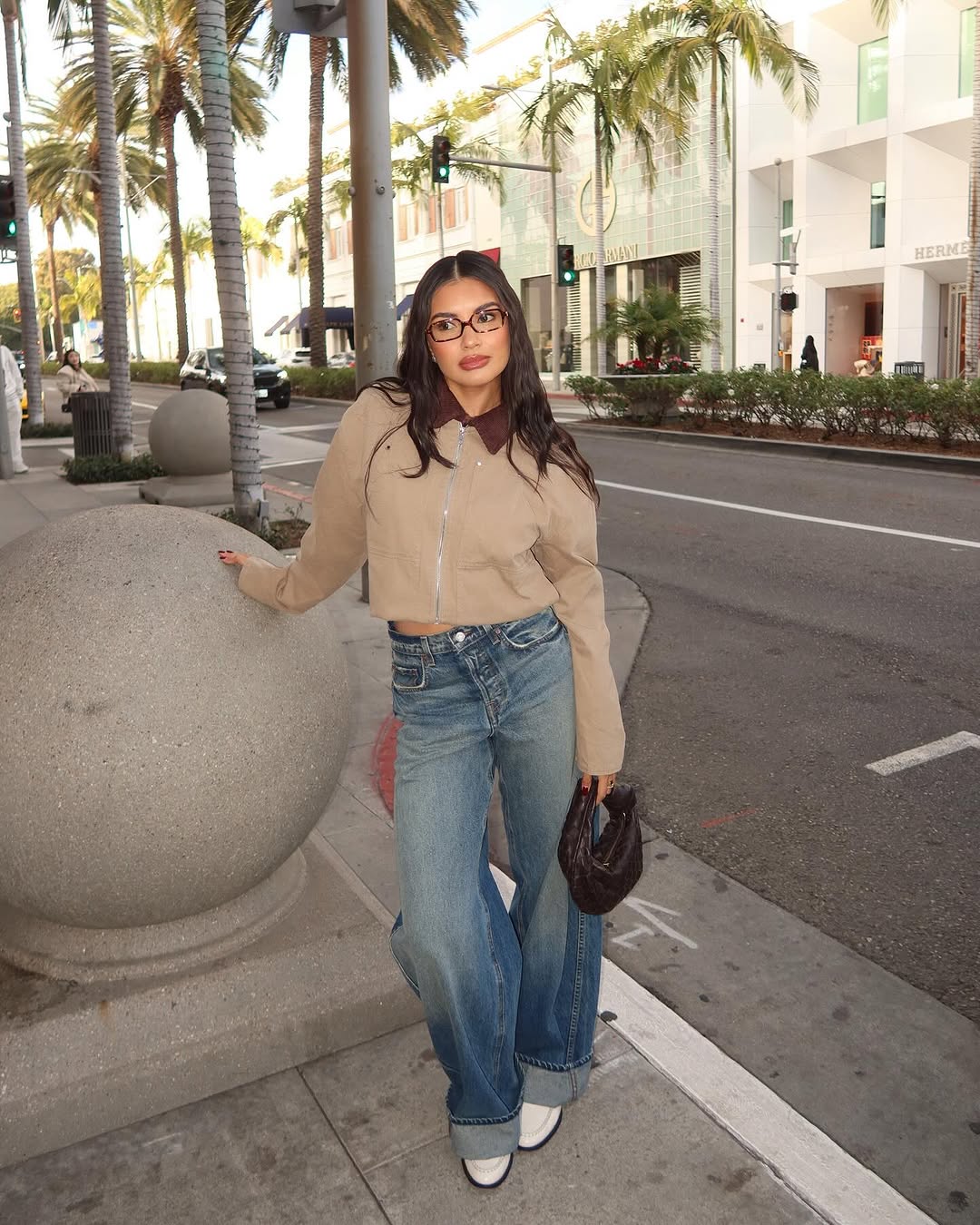 woman wearing dirty denim wash jeans fall denim trend 2025