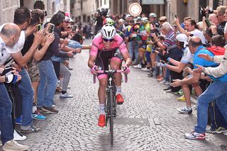 Bob Jungels (Etixx-QuickStep) leads the three breakaway riders through up the final small cobbled climb before the finish line in Asolo