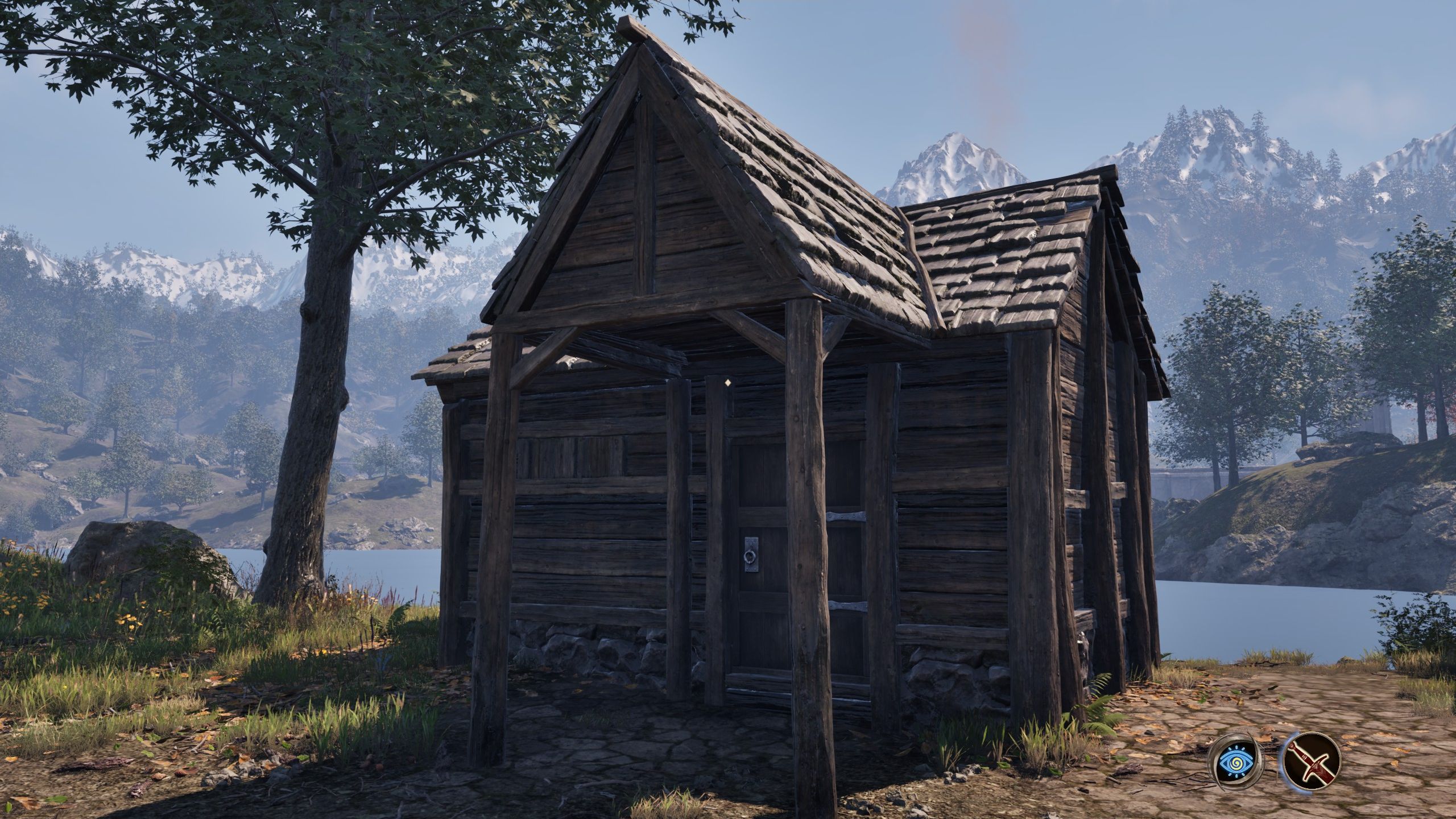 A shack next to a tree by the water