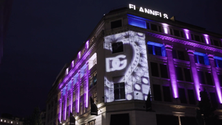 A Hippotizer server and Epson projector light up the side of a building with the D&G logo projection mapped.