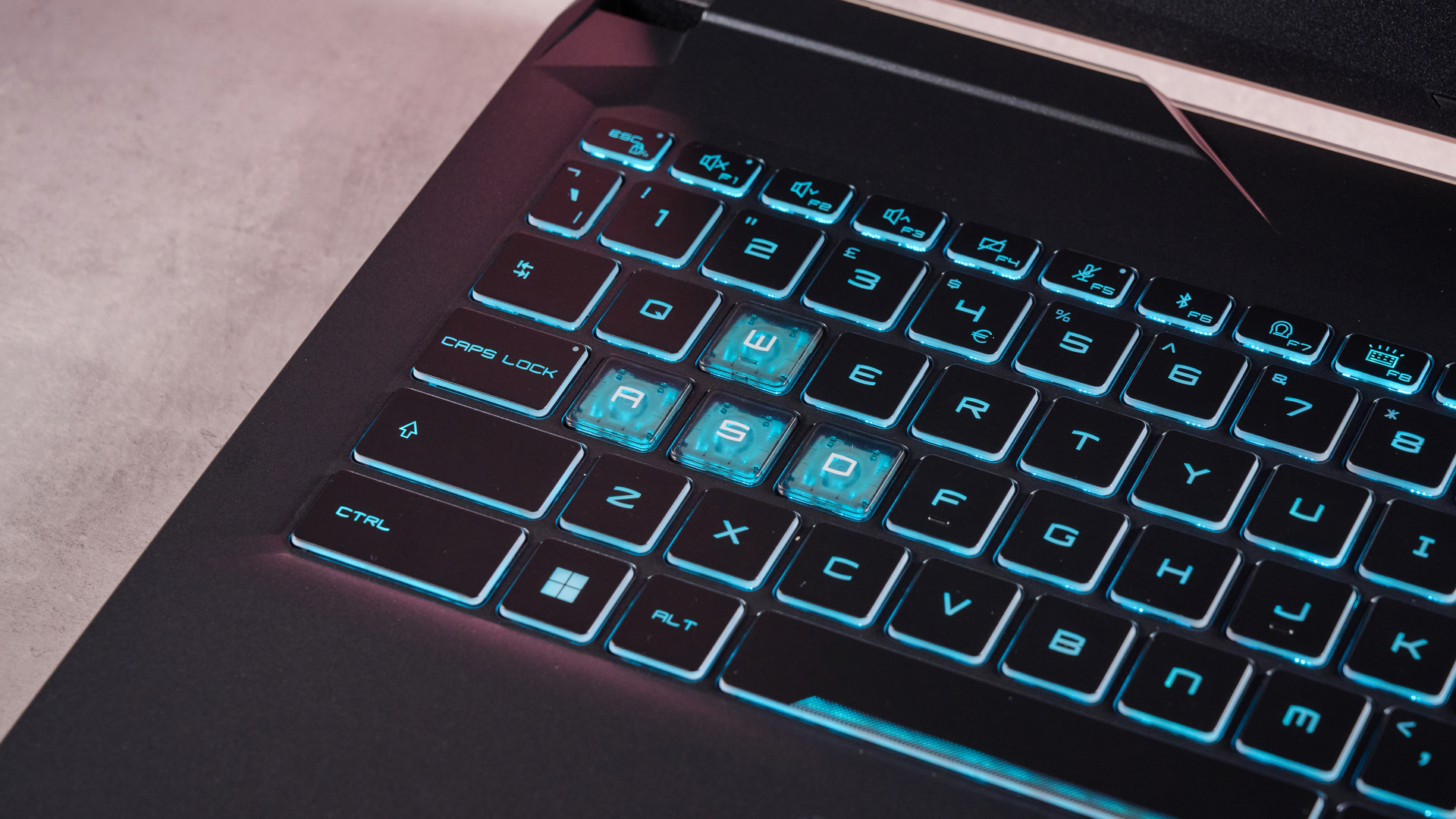Close-up of WASD keys on the MSI Cyborg 15, with blue backlighting on