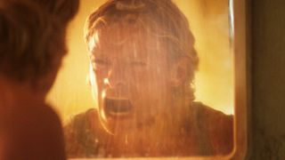 Matt Hagen screaming at his reflection in a mirror in Clayface