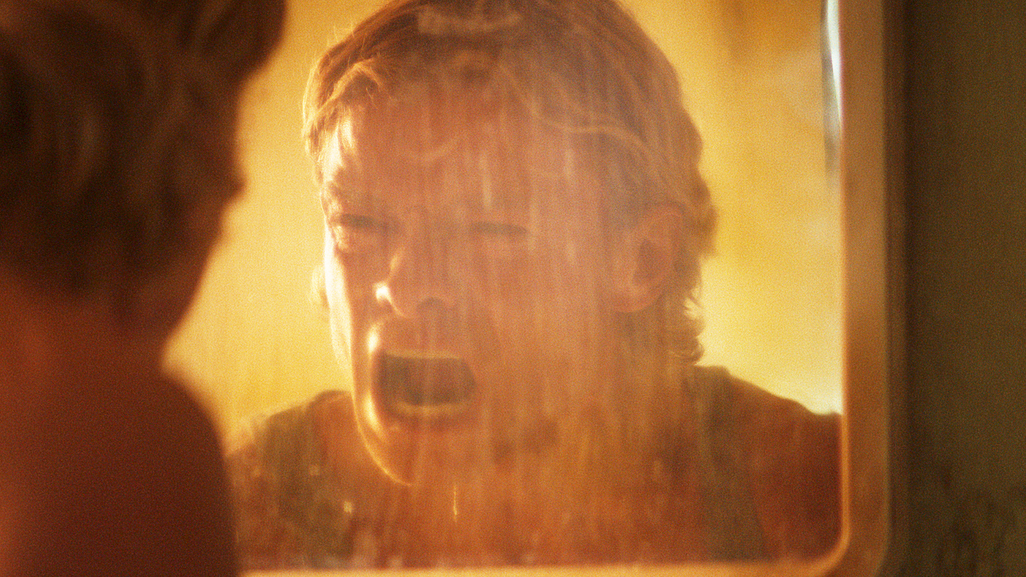 Matt Hagen screaming at his reflection in a mirror in Clayface