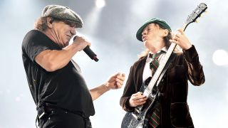 Singer Brian Johnson (L) and musician Angus Young of AC/DC perform at Dodger Stadium on September 28, 2015 in Los Angeles, California