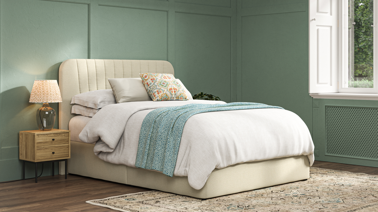 a upholstered ottoman storage bed in a panelled wall bedroom