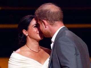 Prince Harry and Meghan Markle kissing