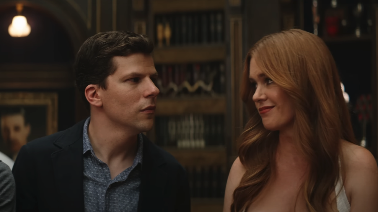 Jesse Eisenberg and Isla Fisher looking over to each other in Now You See Me 3