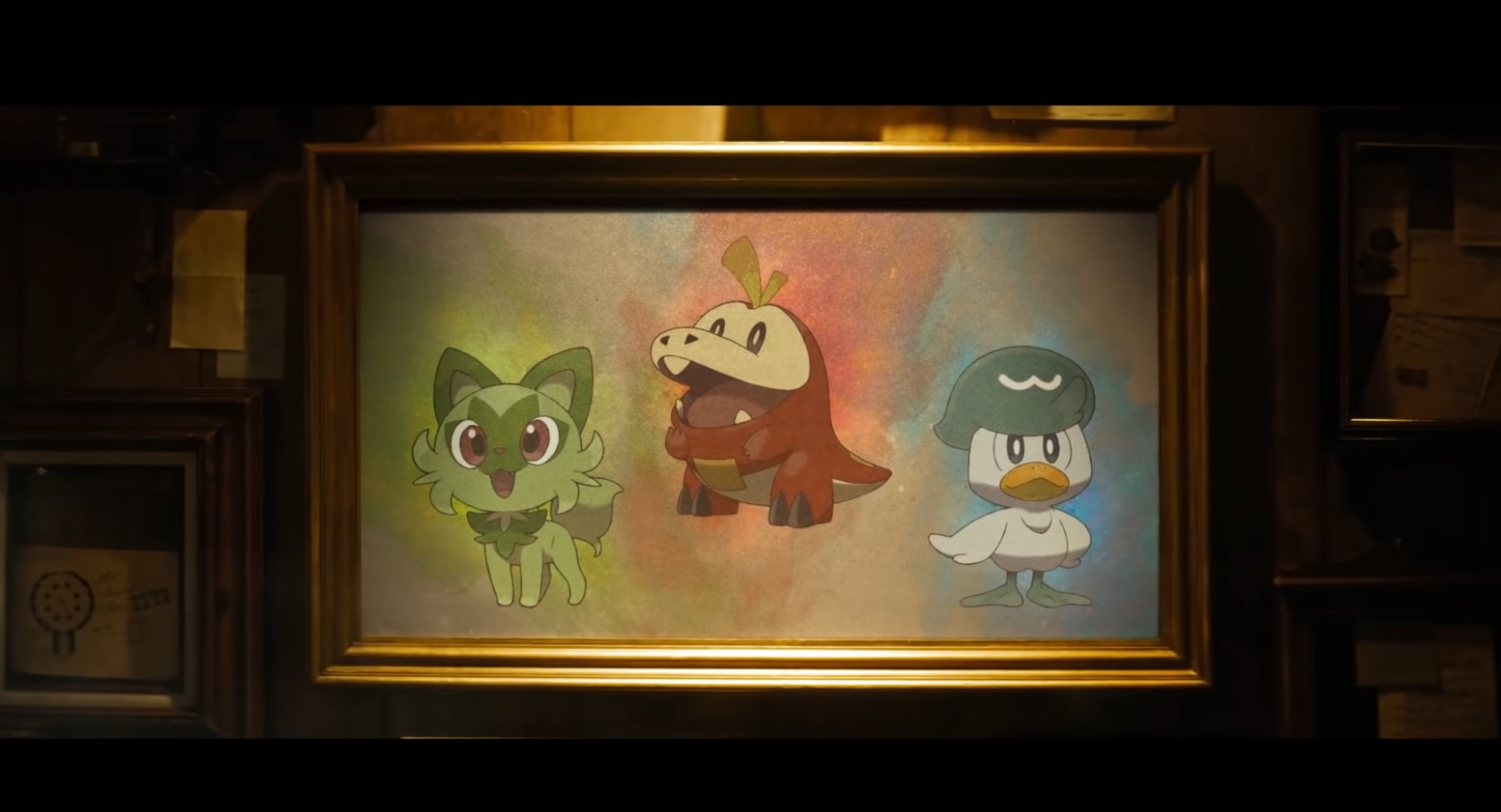 The three starter Pokémon are seen on a painting.
