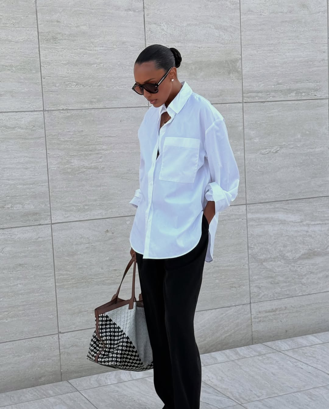 Jasmine Tookes wearing diamond stud earrings