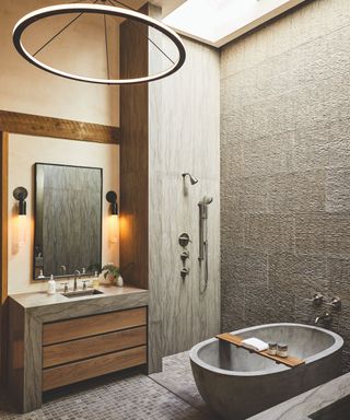 minimalist modern bathroom with grey stone and tiling