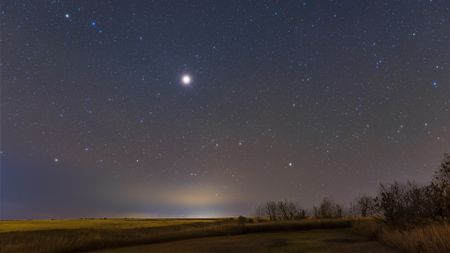 A photo of Mars shining brightly in the night sky