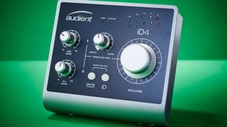 Audient iD4 audio interface on a green background