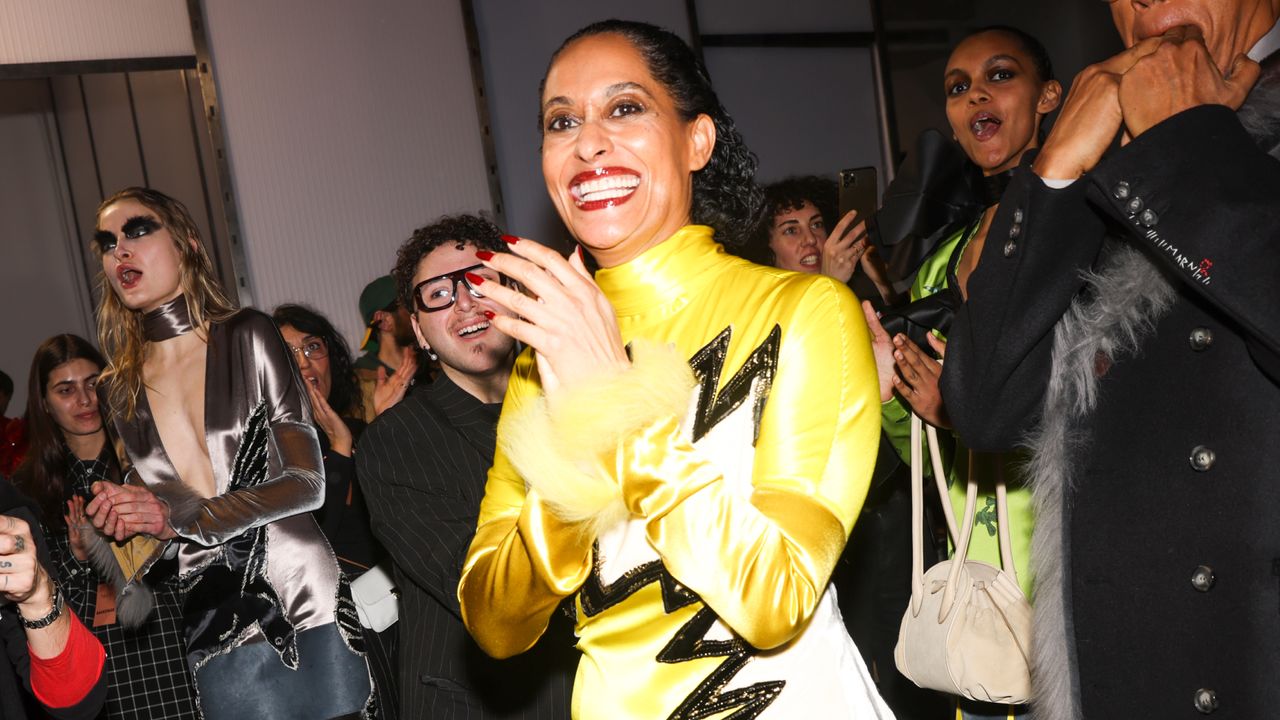 Tracee Ellis Ross wearing an electric yellow dress with beaded stripes at the Marni Fall 2025 runway show