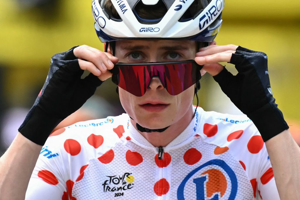 Team Visma - Lease a Bike team's Danish rider Jonas Vingegaard wearing the climber's polka dot (dotted) jersey (second placed in the category) awaits the start of the 19th stage of the 111th edition of the Tour de France cycling race, 144,6 km between Embrun and Isola 2000, in the French Alps, on July 19, 2024. (Photo by Marco BERTORELLO / AFP)