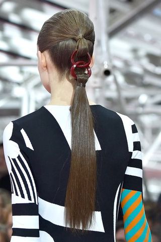 Hairstyle, Style, Uniform, Fashion, Neck, Hair accessory, Jersey, Brown hair, Earrings, Long hair,