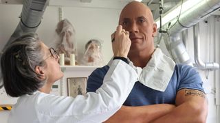 Artists at the Grévin Museum working to improve Dwayne Johnson's waxwork