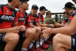 Riders for BMC Racing rode aboard a WWII military vehicle during the Tour de France team presentation.
