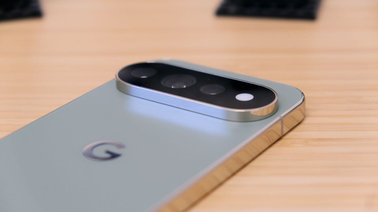 The Google Pixel 11 Pro resting on a wooden table