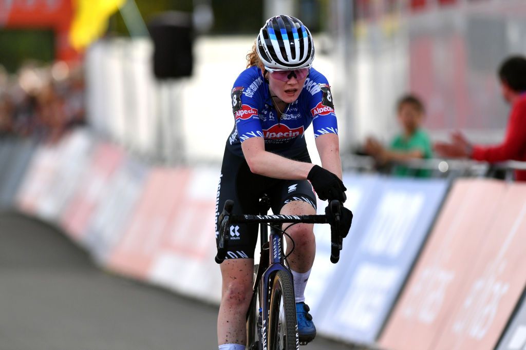 MAASMECHELEN BELGIUM OCTOBER 30 Puck Pieterse of The Netherlands and Team Alpecin Deceuninck crosses the finish line during the 1st UCI Cyclocross World Cup Maasmechelen Womens Elite CXWorldCup on October 30 2022 in Maasmechelen Belgium Photo by Luc ClaessenGetty Images