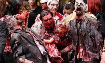 Men dressed as zombies walk through the central business district during the Sydney Zombie Walk on Oct. 24.