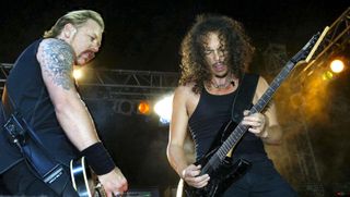 James Hetfield (left) and Kirk Hammett perform with Metallica at The Download Festival in Donnington Park, England on May 31, 2003