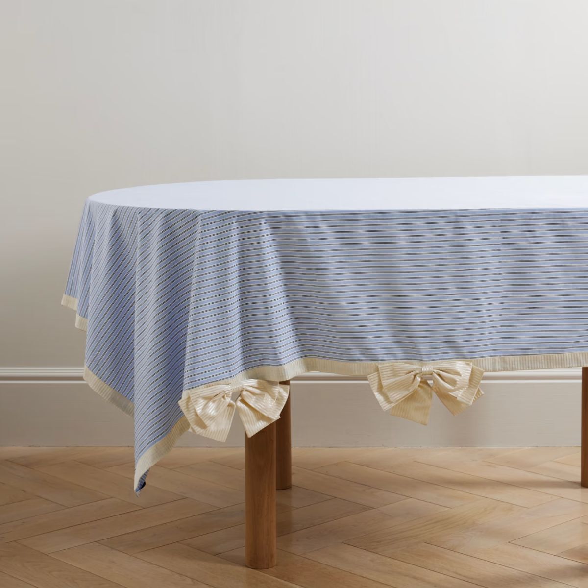 A blue tablecloth with bow detailing