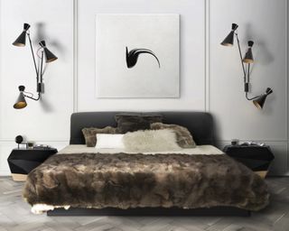 Teenage boys bedroom idea with black wall lights and faux fur throws on bed
