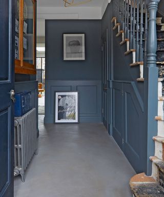 Modern hallway flooring with concrete floor and blue walls
