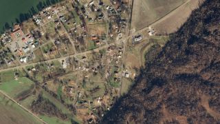 A Planet satellite captured the damage wrought by a tornado on Dec. 10, 2021, in Samburg, Tennessee.