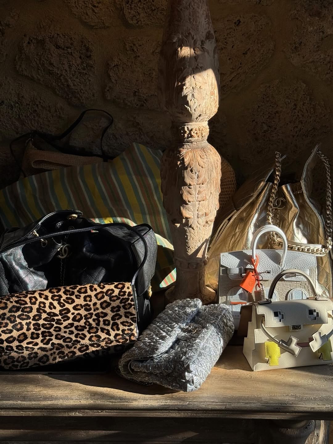 a pile of designer bags in Kylie Jenner's vacation home including her The Row striped barn tote