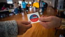 A man gets an "I Voted" sticker