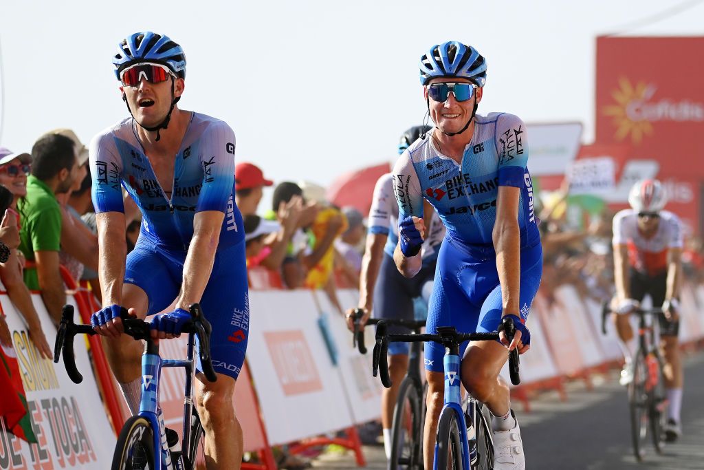 CABO DE GATA SPAIN AUGUST 31 LR Luke Durbridge of Australia and Lucas Hamilton of Australia and Team BikeExchange Jayco cross the finishing line and celebrate the victory of his teammate Kaden Groves of Australia during the 77th Tour of Spain 2022 Stage 11 a 1912km stage from ElPozo Alimentacin Alhama de Murcia to Cabo de Gata LaVuelta22 WorldTour on August 31 2022 in Cabo de Gata Spain Photo by Tim de WaeleGetty Images