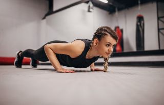 Woman performs a press up