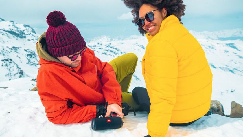 JBL flip Bluetooth speaker and two people in the snow