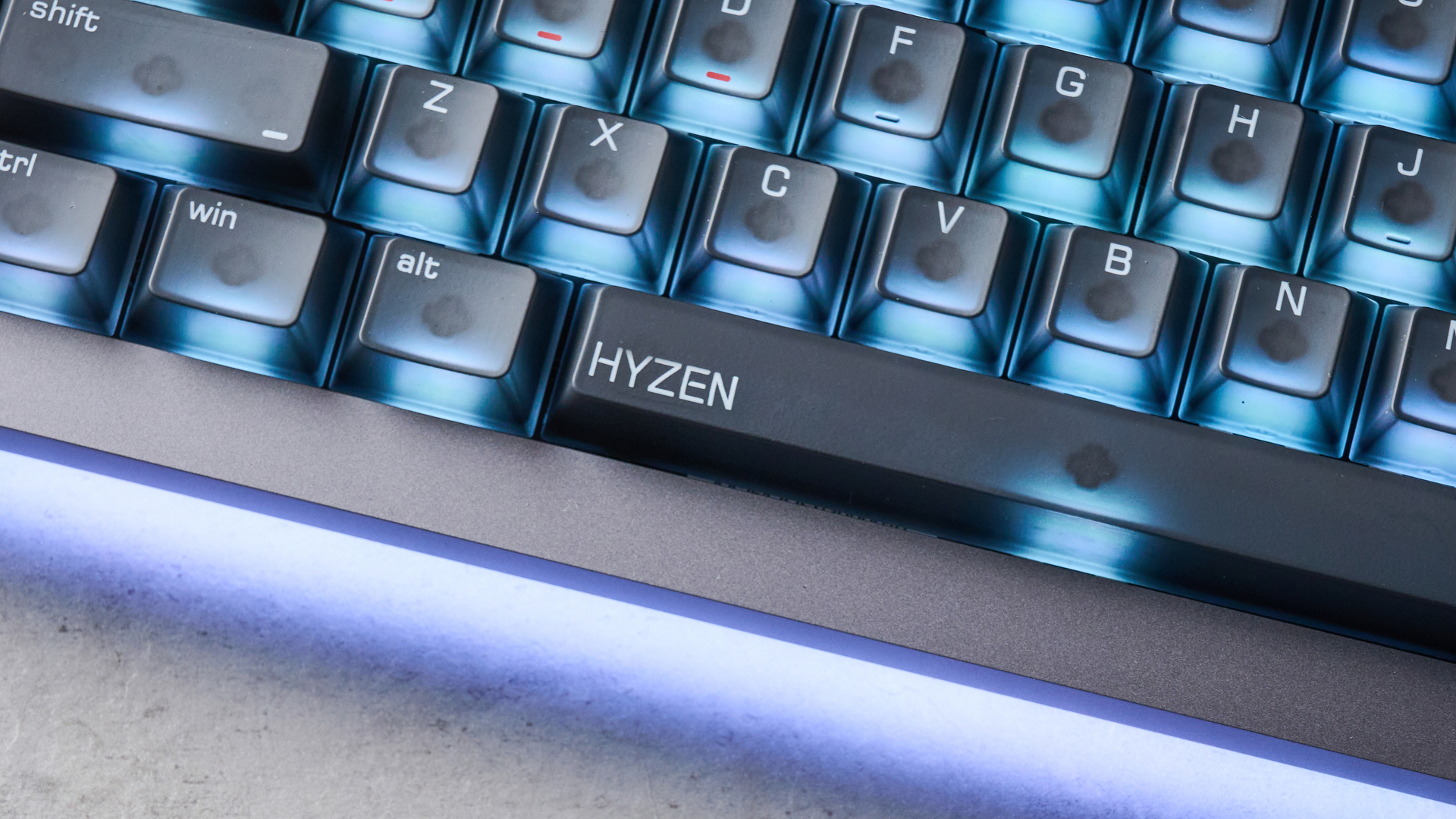The Lofree Hyzen keyboard on a stone surface