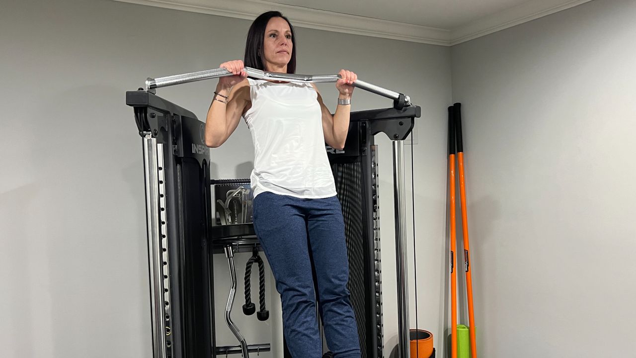 Wendy Batts in a pull-up position