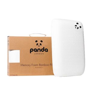 A pillow with a box with a panda illustration on it