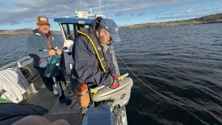 two men on a small boat