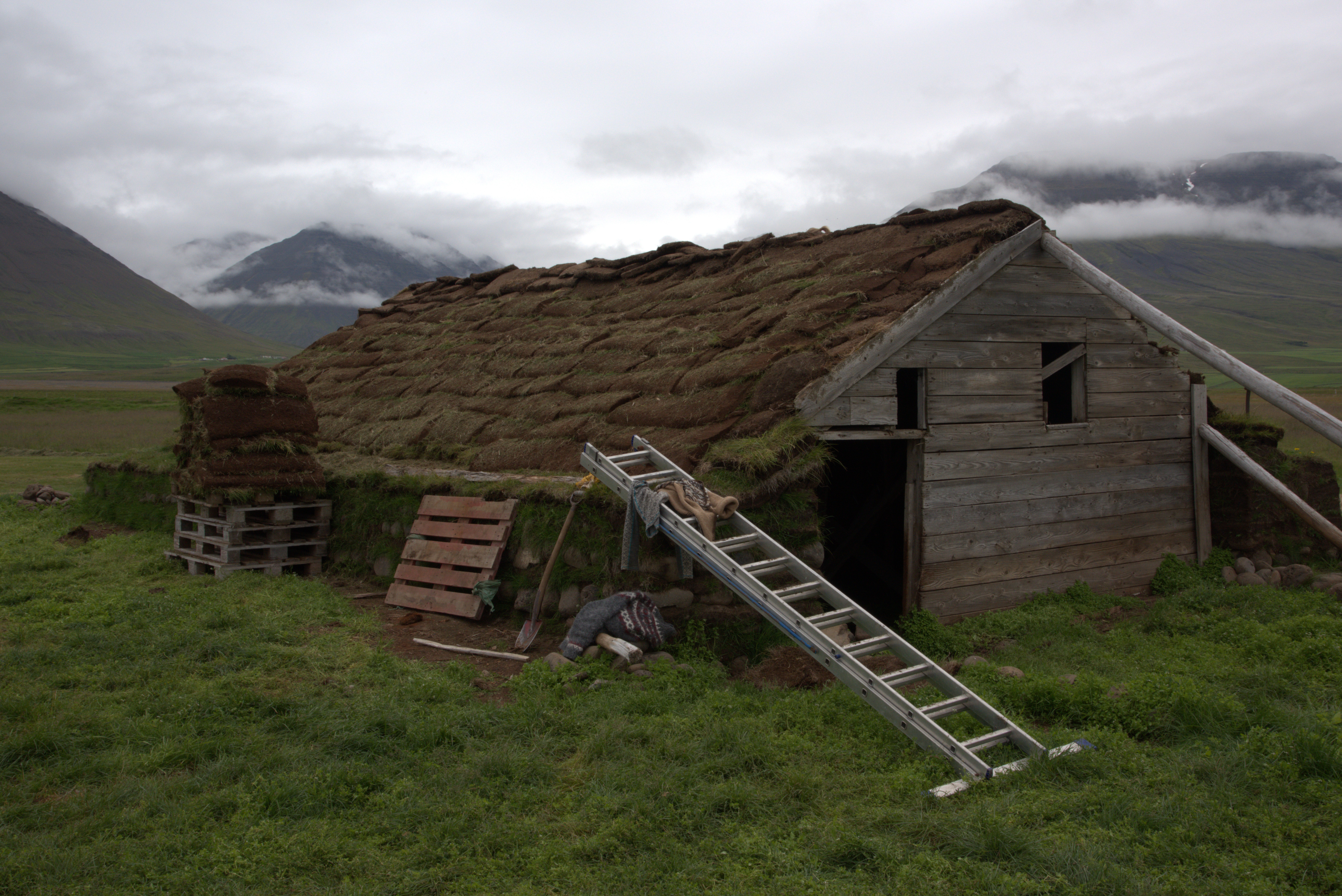 Turf house example of home with green roof embedded into field and the earth