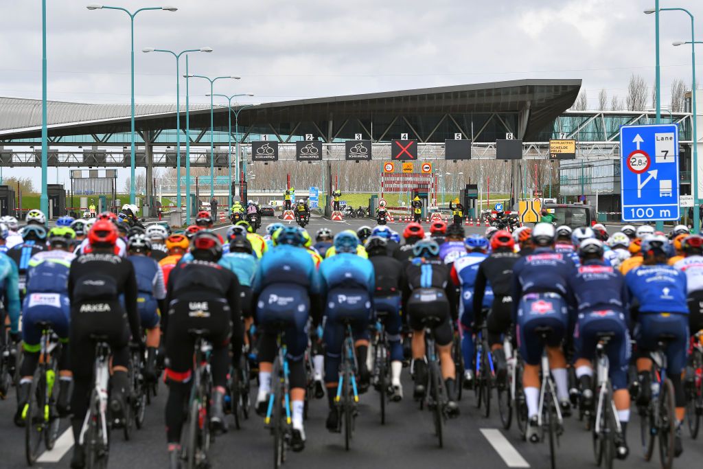 SCHOTEN BELGIUM APRIL 07 The Peloton passing through a Highway toll during the 109th Scheldeprijs 2021 Mens Elite a 1942km race from Terneuzen to Schoten Landscape SP21 FlandersClassic on April 07 2021 in Schoten Belgium Photo by Luc ClaessenGetty Images