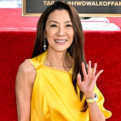 Michelle Yeoh attended her Hollywood Walk of Fame ceremony in a yellow satin dress from Dior