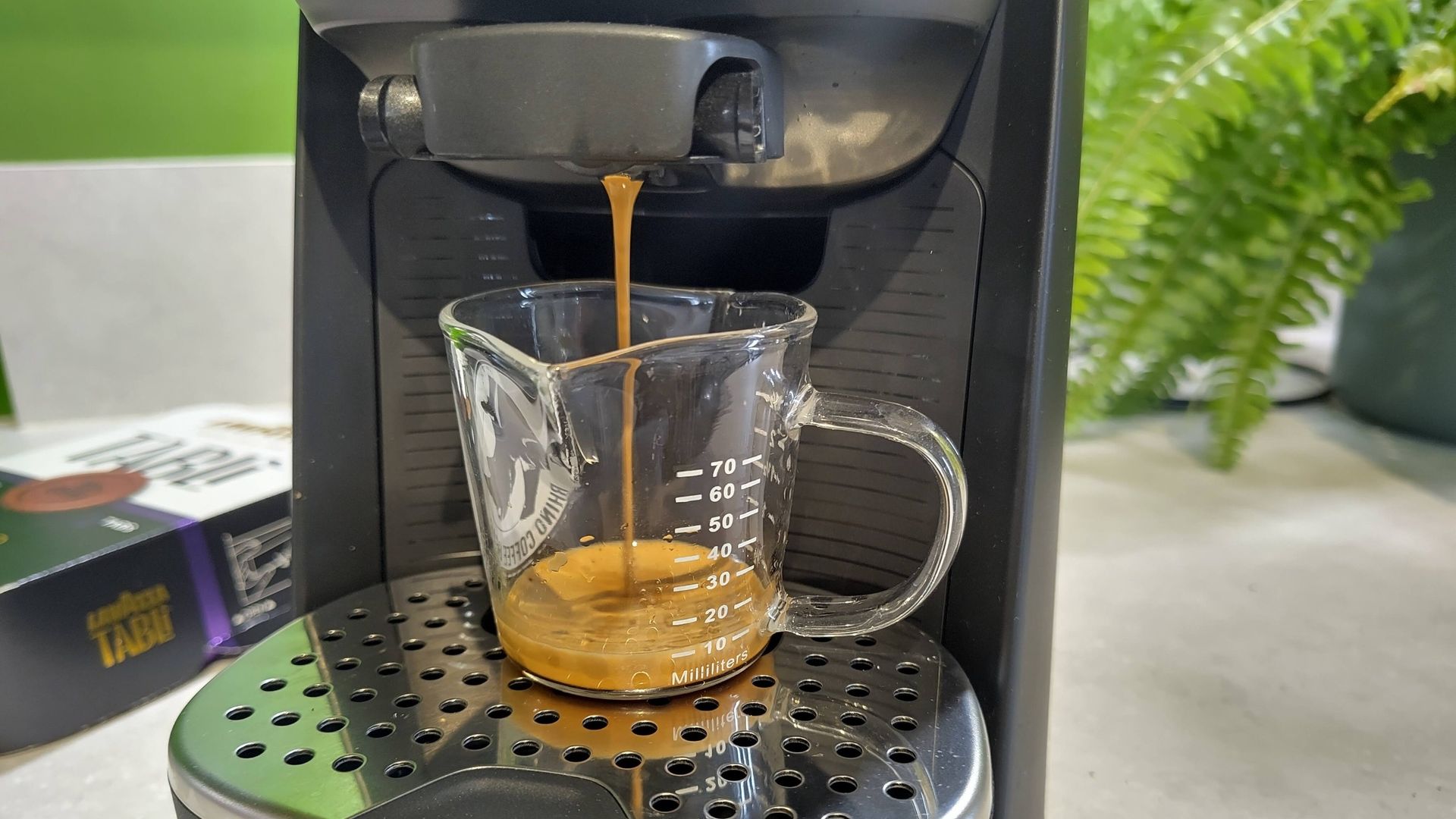 Lavazza Tabli coffee machine dispensing espresso