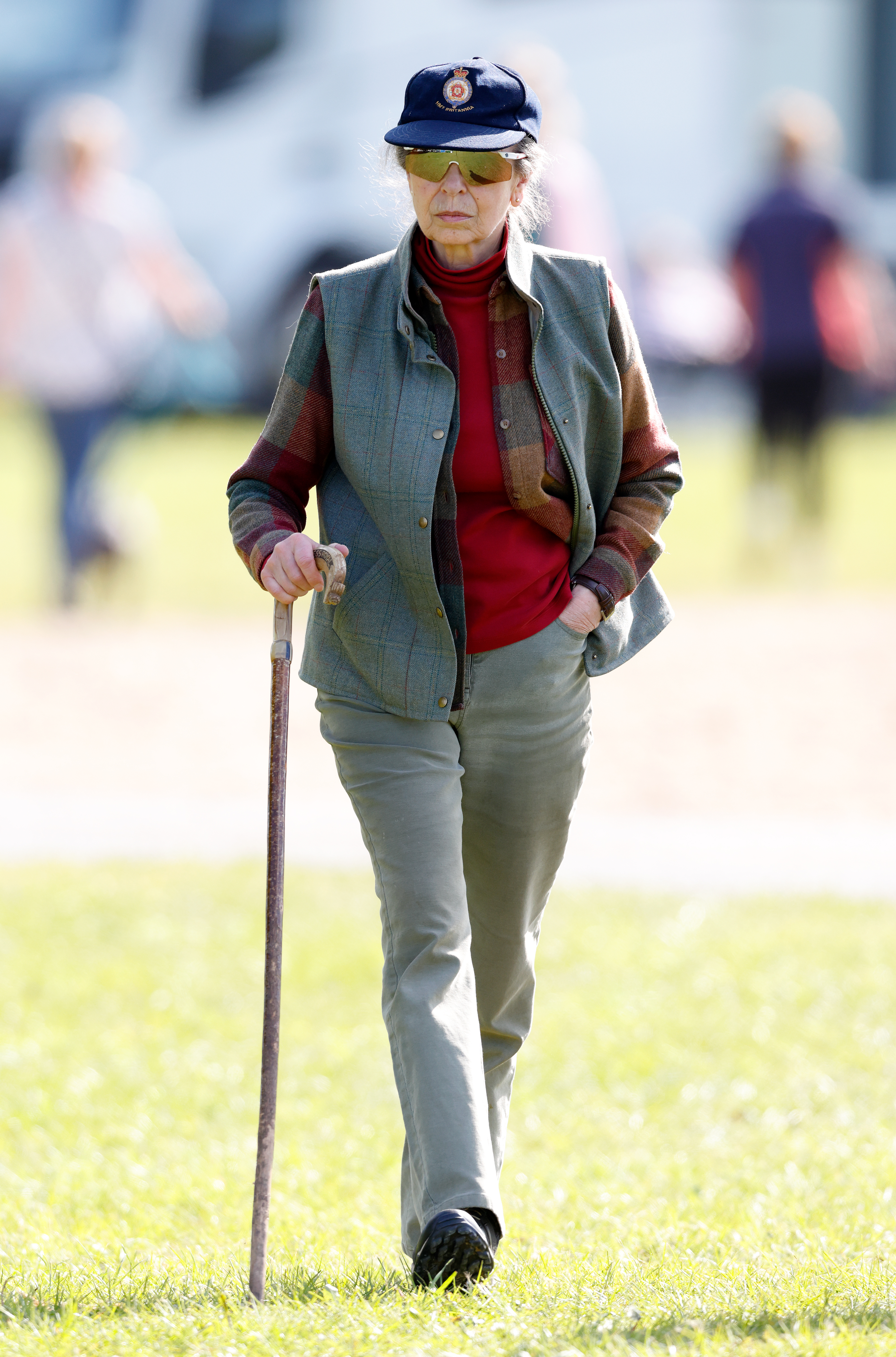 Princess Anne walking with a walking stick