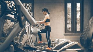 woman trying to do elliptical workout ideas